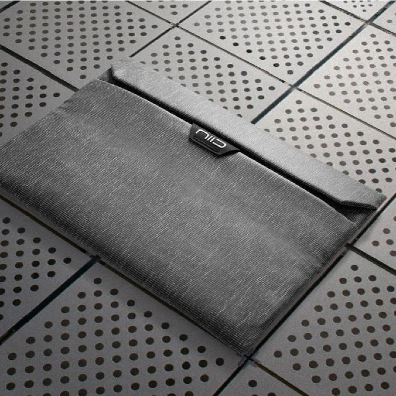 Foldable fabric travel bag for convenient storage when not in useNIID Integrated Laptop Sleeve Foldable fabric travel bag for convenient storage when not in useNIID Integrated Laptop Sleeve