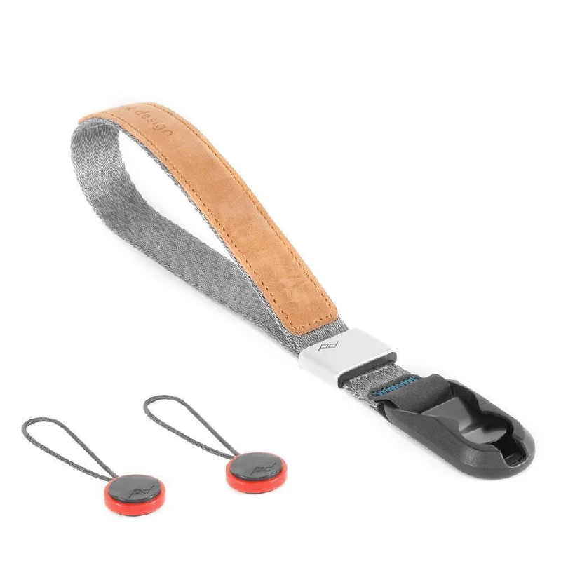 Travel bag with a built - in power bank charger for on - the - go device chargingPeak Design Cuff Camera Hand Strap