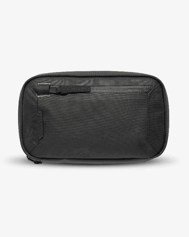Designer - branded leather travel bag for luxury business travelersSympl Tech Kit 2L
